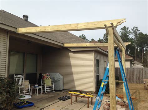 covered patio with metal brackets below deck|patio attached to fascia board.